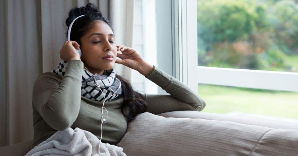 Woman resting in a quiet space as part of nervous system self-care for ADHD and AuDHD